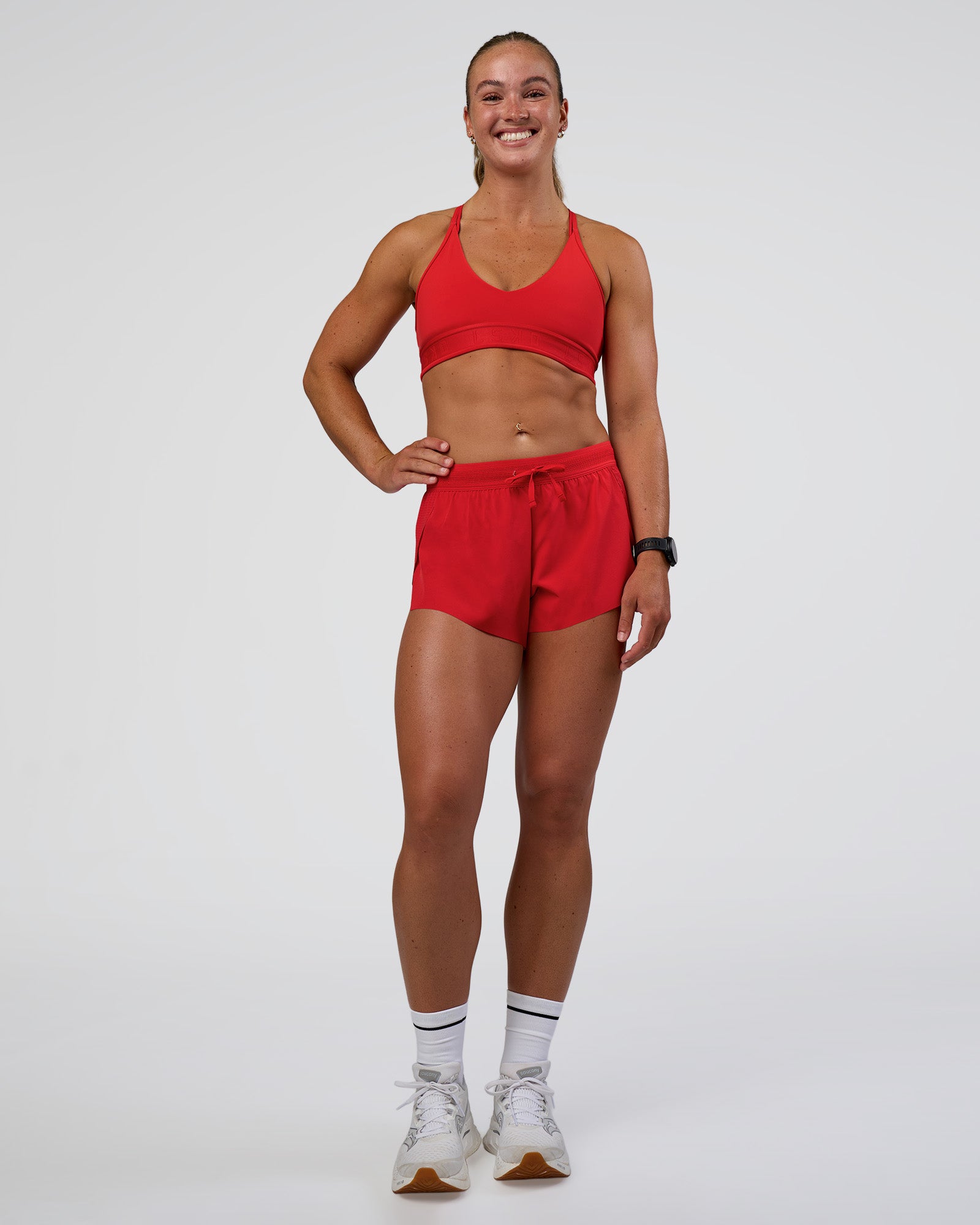 Woman wearing Accelerate 3" Mid-Rise Running Short - Flame | Model:Sav | Size:S