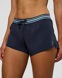 Woman wearing Accelerate 3" Mid-Rise Running Short - Future Navy-Baltic Sea | Set:true | Angle:closeup | Model:Evie | Size:S