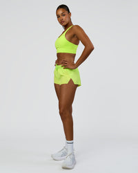 Woman wearing Accelerate 3" Mid-Rise Running Short - Hyper Green | Model:Rosie | Size:S