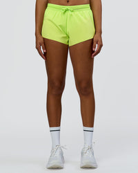 Woman wearing Accelerate 3" Mid-Rise Running Short - Hyper Green | Set:true | Angle:front | Model:Rosie | Size:S