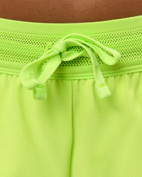 Woman wearing Accelerate 3" Mid-Rise Running Short - Hyper Green | Model:Rosie | Size:S