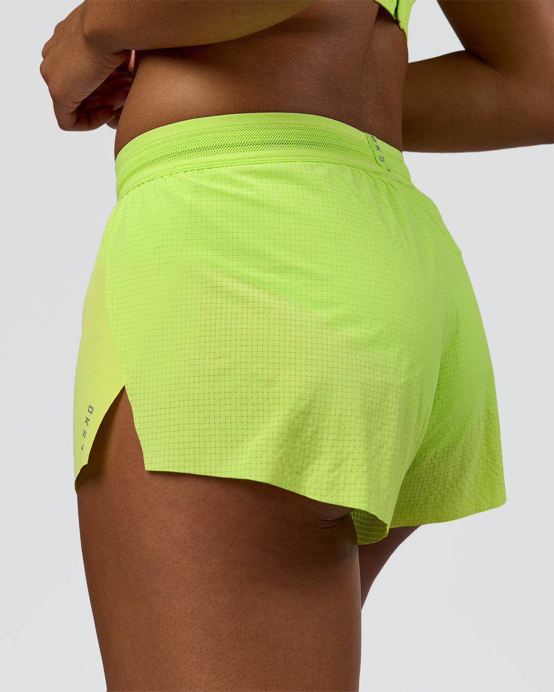 Woman wearing Accelerate 3" Mid-Rise Running Short - Hyper Green | Model:Rosie | Size:S