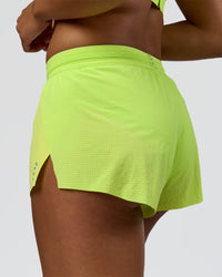 Woman wearing Accelerate 3" Mid-Rise Running Short - Hyper Green | Model:Rosie | Size:S