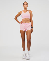 Woman wearing Accelerate 3" Mid-Rise Running Short - Marshmallow | Model:Rhiley | Size:S