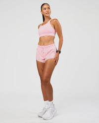 Woman wearing Accelerate 3" Mid-Rise Running Short - Marshmallow | Model:Rhiley | Size:S