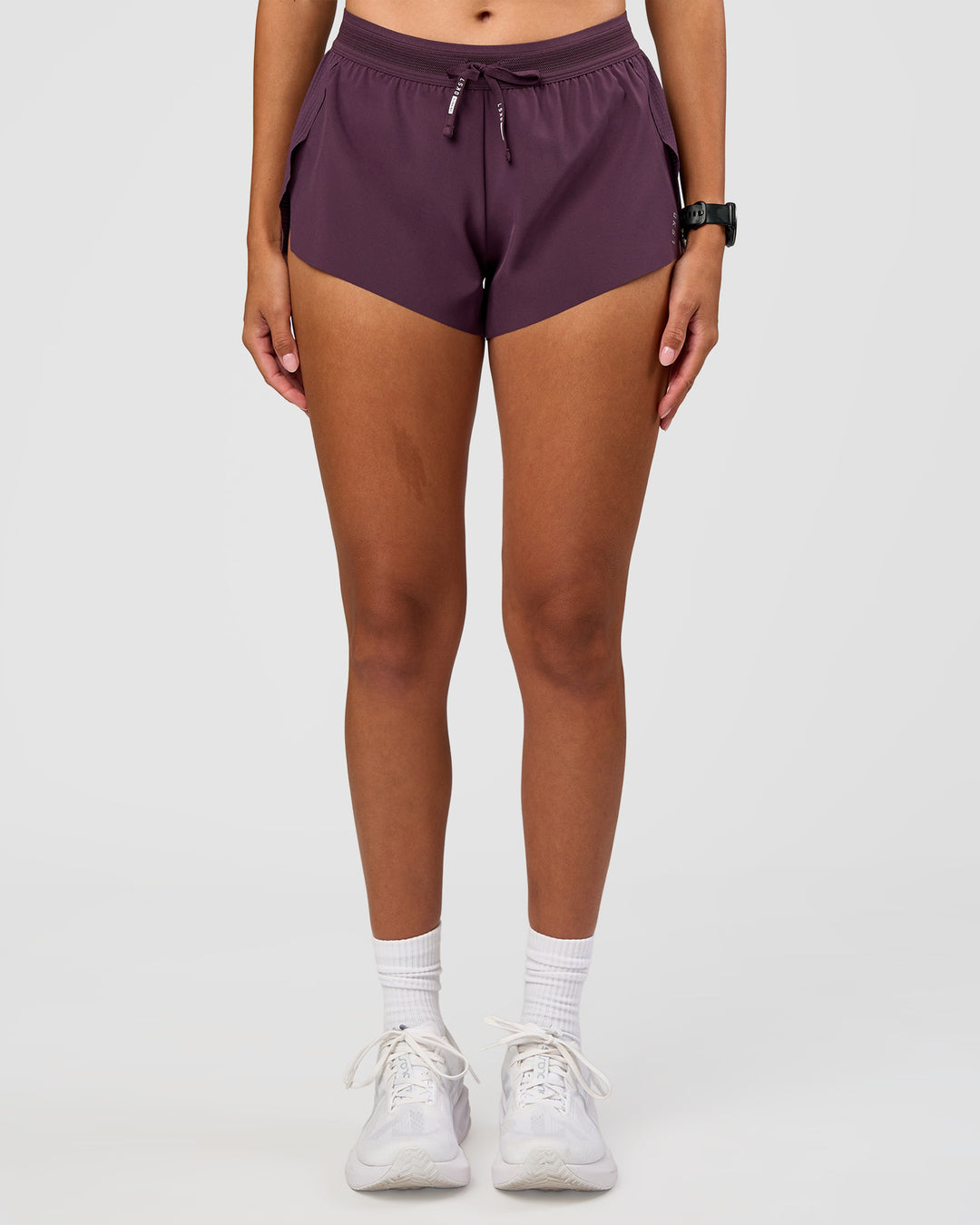 Woman wearing Accelerate 3" Mid-Rise Running Short - Midnight Plum | Set:true | Angle:front | Model:Rhiley | Size:S