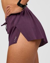 Woman wearing Accelerate 3" Mid-Rise Running Short - Midnight Plum | Model:Rhiley | Size:S