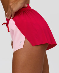 Woman wearing Accelerate 3" Mid-Rise Running Short - Scarlet-Marshmallow | Model:Amity | Size:S