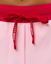 Woman wearing Accelerate 3" Mid-Rise Running Short - Scarlet-Marshmallow | Model:Amity | Size:S