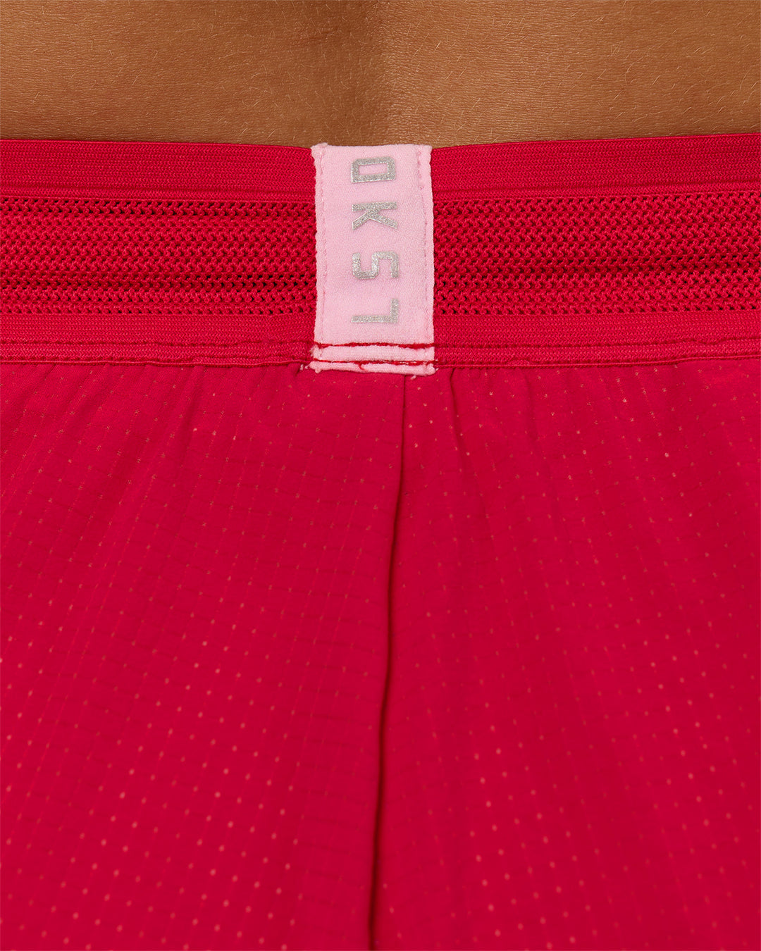 Woman wearing Accelerate 3" Mid-Rise Running Short - Scarlet-Marshmallow | Model:Amity | Size:S