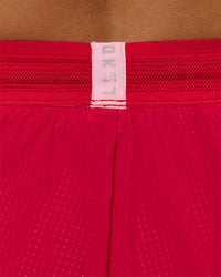 Woman wearing Accelerate 3" Mid-Rise Running Short - Scarlet-Marshmallow | Model:Amity | Size:S