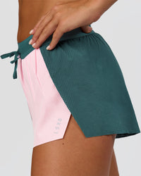 Woman wearing Accelerate 3" Mid-Rise Running Short - Transformative Teal-Marshmallow | Model:Amity | Size:S