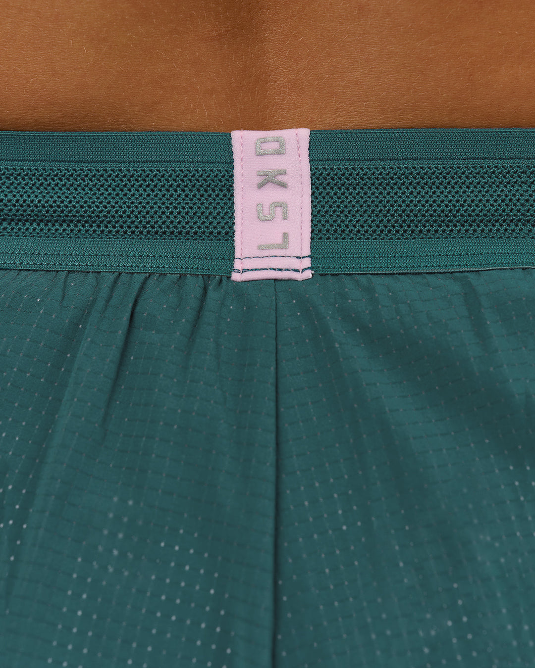 Woman wearing Accelerate 3" Mid-Rise Running Short - Transformative Teal-Marshmallow | Model:Amity | Size:S