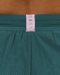 Woman wearing Accelerate 3" Mid-Rise Running Short - Transformative Teal-Marshmallow | Model:Amity | Size:S