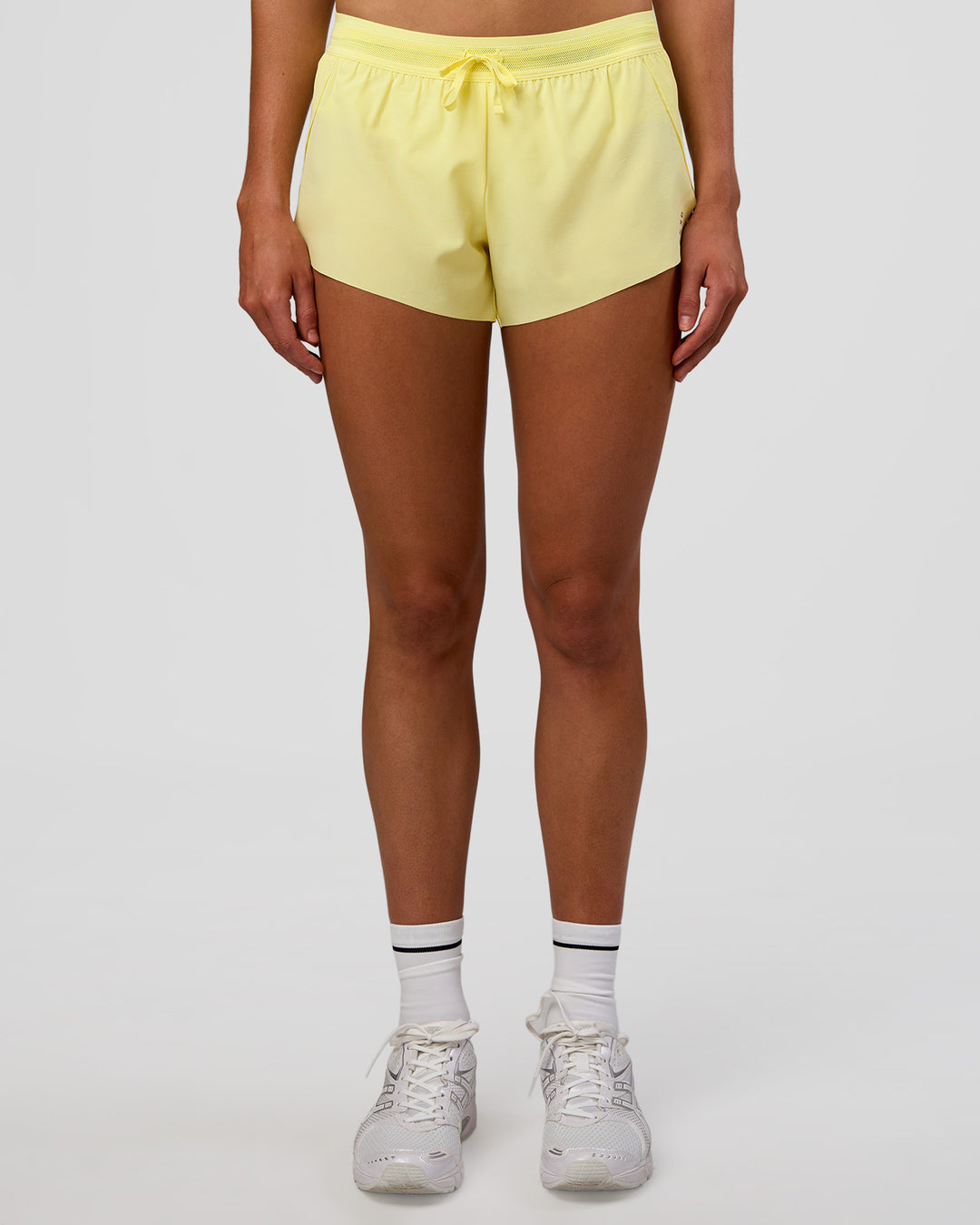 Woman wearing Accelerate 3&quot; Mid-Rise Running Short - Yellow Fizz | Model:Evie | Size:S