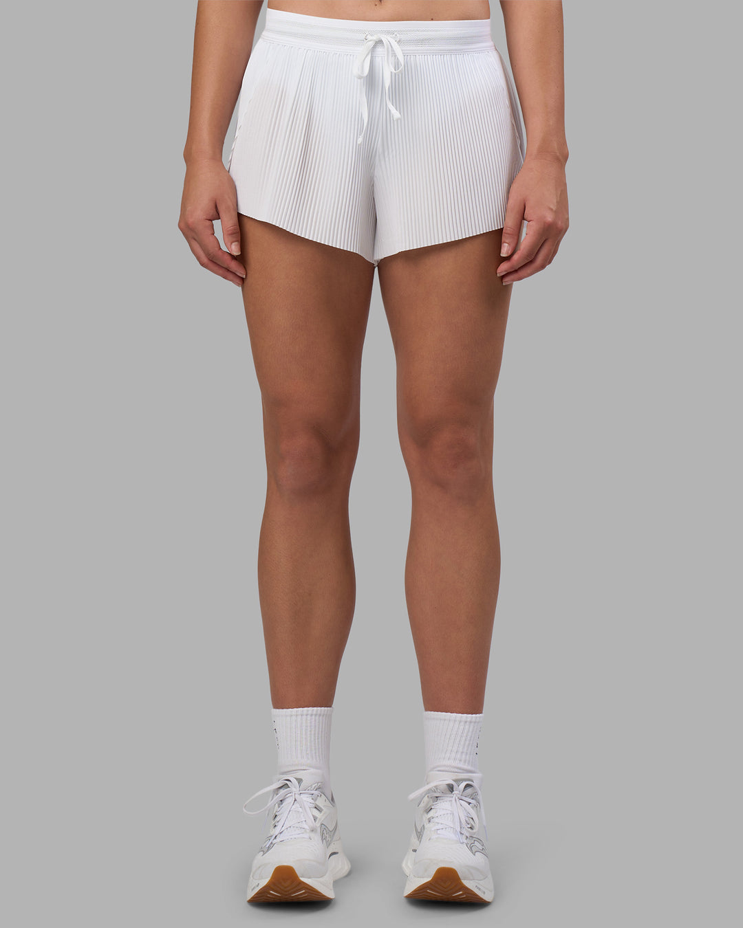 Woman wearing Accelerate 3&quot; Pleated Running Short - White | Model:Charlize | Size:S