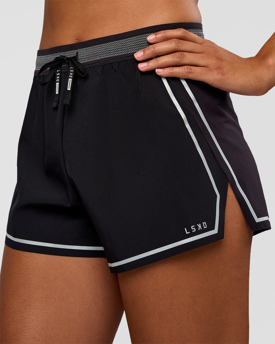 Woman wearing Accelerate 3" Reflective High-Rise Running Short - Black-Reflective | Set:true | Angle:closeup | Model:Rosie | Size:S