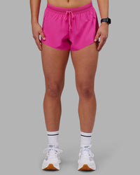 Woman wearing Accelerate 3" Running Short - Ultra Pink | Set:true | Angle:front | Model:Keisha | Size:S