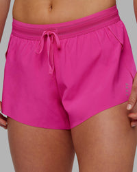 Woman wearing Accelerate 3" Running Short - Ultra Pink | Set:true | Angle:closeup | Model:Keisha | Size:S