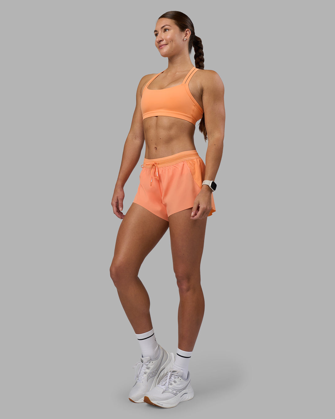 Woman wearing Accelerate 3&quot; Running Short - Cantaloupe | Model:Hannah | Size:S