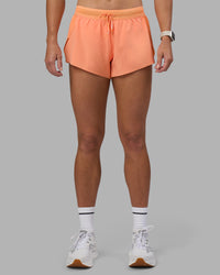 Woman wearing Accelerate 3" Running Short - Cantaloupe | Set:true | Angle:front | Model:Hannah | Size:S