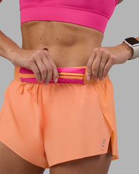 Woman wearing Accelerate 3" Running Short - Cantaloupe | Model:Hannah | Size:S