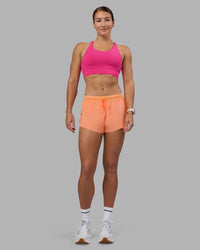 Woman wearing Accelerate 3" Running Short - Cantaloupe | Model:Hannah | Size:S