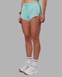 Woman wearing Accelerate 3" Running Short - Island Paradise | Set:true | Angle:side | Model:Shae | Size:S
