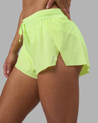 Woman wearing Accelerate 3" Running Short - Lime Glo | Set:true | Angle:closeup | Model:Hannah | Size:S