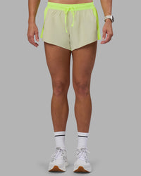 Woman wearing Accelerate 3" Running Short - Lime Glo-Shale Beige | Model:Hannah | Size:S