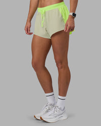 Woman wearing Accelerate 3" Running Short - Lime Glo-Shale Beige | Model:Hannah | Size:S