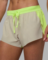 Woman wearing Accelerate 3" Running Short - Lime Glo-Shale Beige | Model:Hannah | Size:S