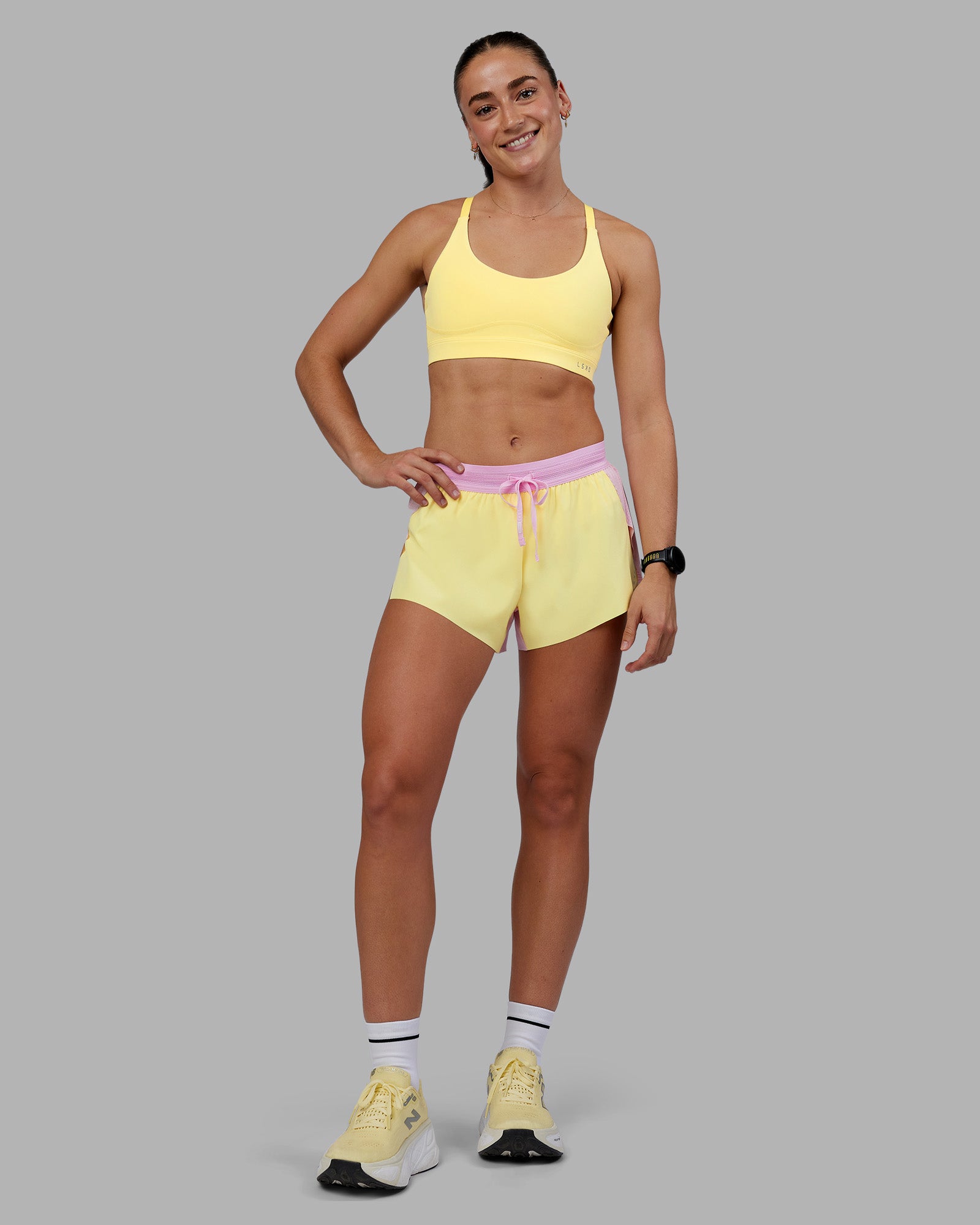 Woman wearing Accelerate 3" Running Short - Marshmallow-Lemon | Model:Grace | Size:S