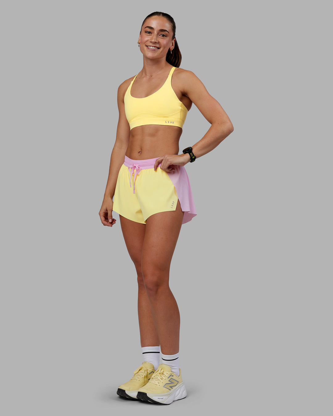 Woman wearing Accelerate 3&quot; Running Short - Marshmallow-Lemon | Model:Grace | Size:S