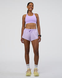Woman wearing Accelerate 3" Running Short - Pale Lilac | Model:Rica | Size:S