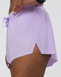Woman wearing Accelerate 3" Running Short - Pale Lilac | Model:Rica | Size:S