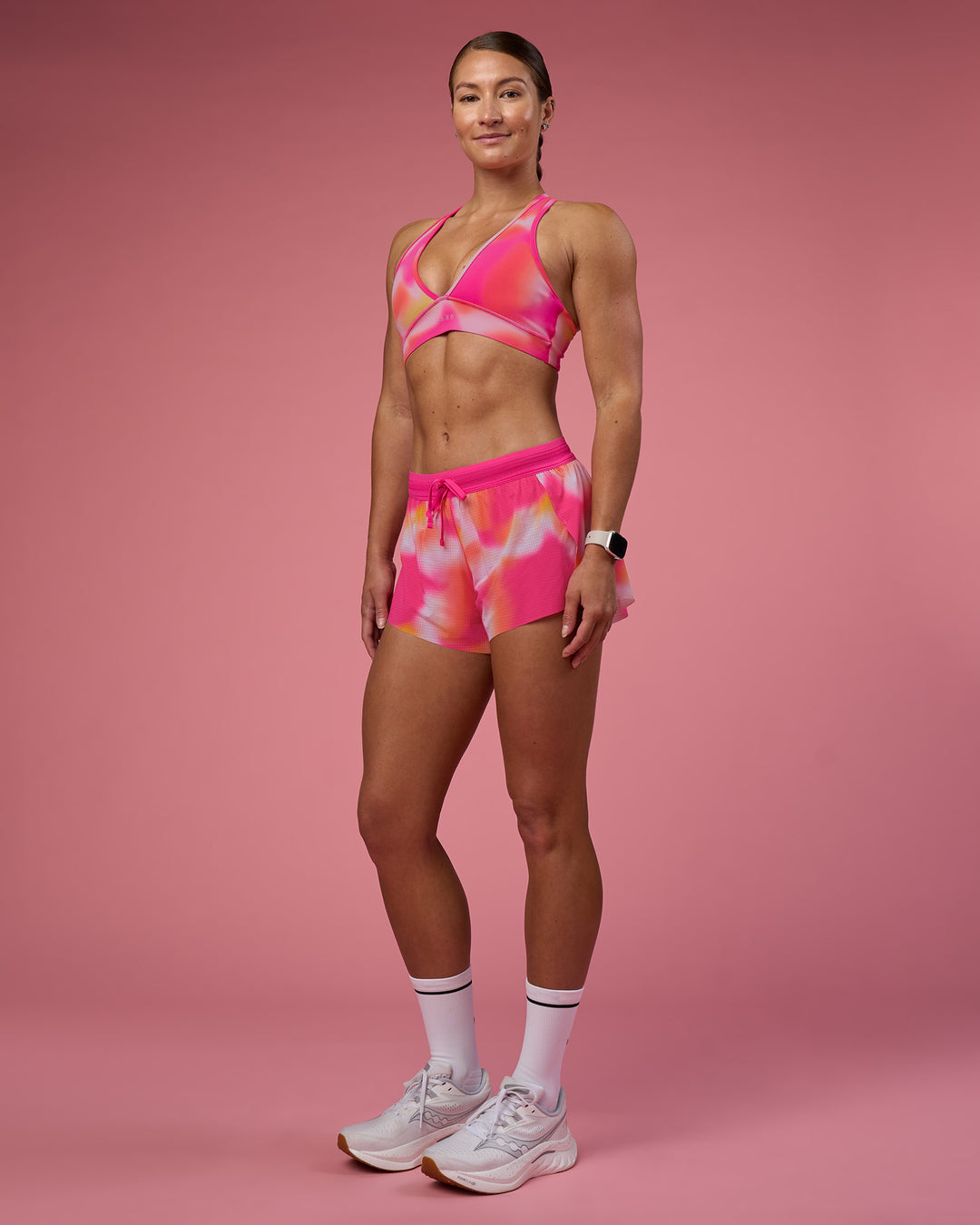 Woman wearing Accelerate 3&quot; Running Short - Pink Glow Print | Model:Hannah | Size:S