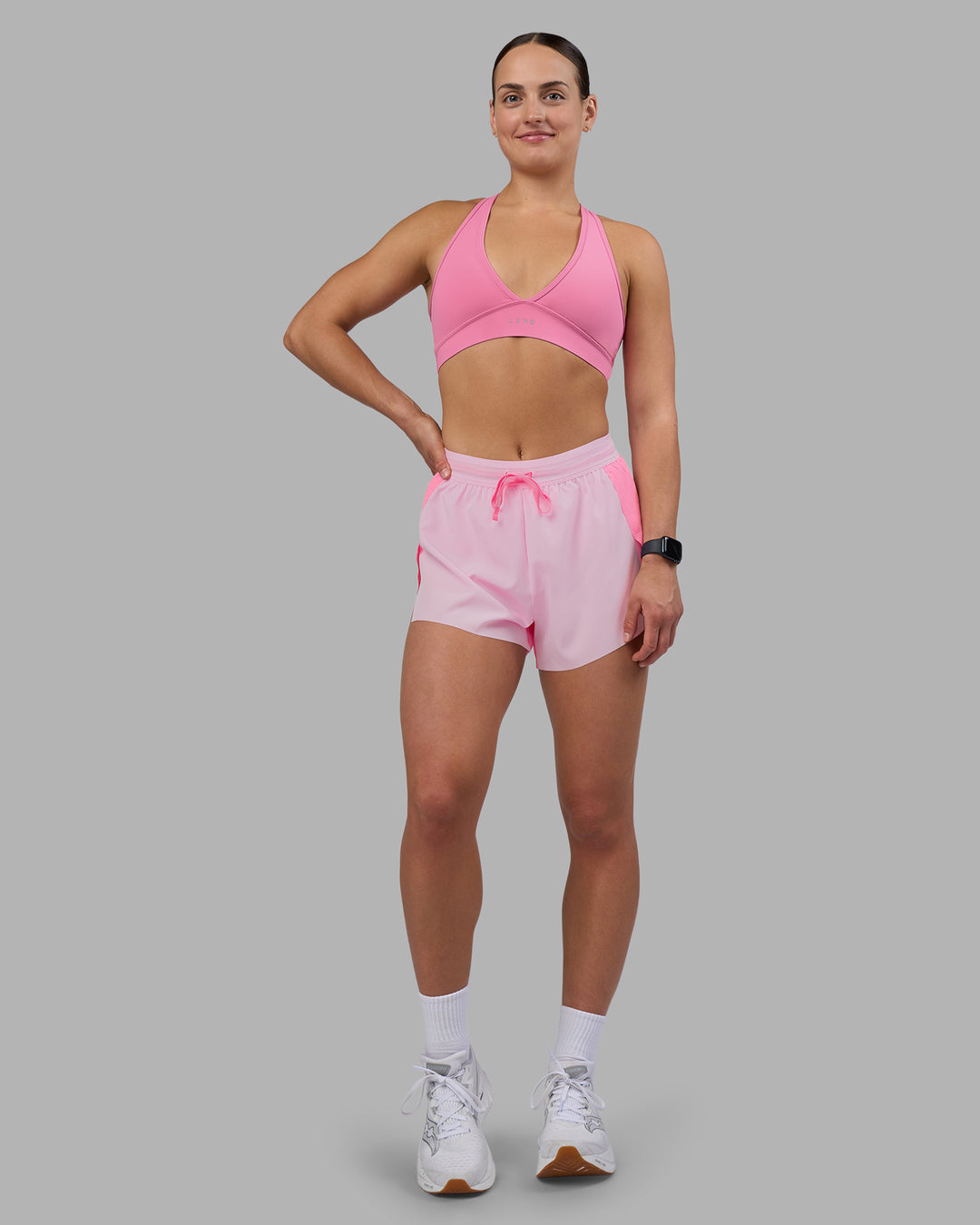 Woman wearing Accelerate 3&quot; High-Rise Running Short - Candy Pink-Marshmallow | Model:Keisha | Size:S