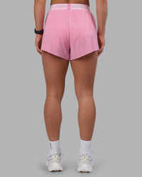 Woman wearing Accelerate 3" High-Rise Running Short - Candy Pink-Marshmallow | Set:true | Angle:back | Model:Keisha | Size:S