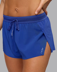 Woman wearing Accelerate 3" Run Short in Power Cobalt | Model:Shalem | Size:S