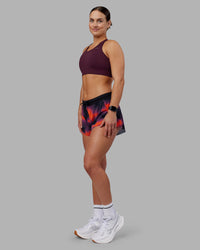 Woman wearing Accelerate Split Strap Sports Bra - Cherry Lacquer | Model:Keisha | Size:S