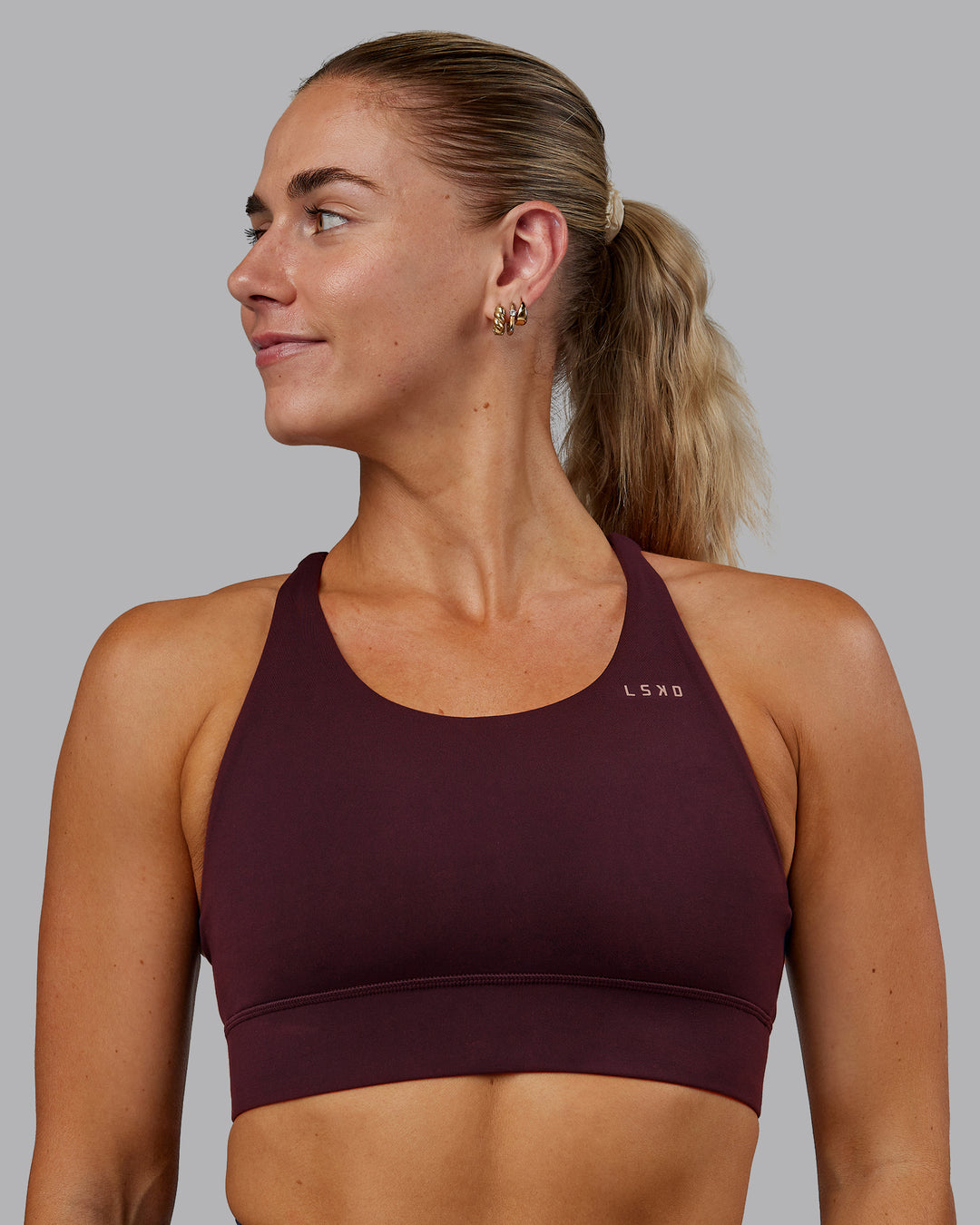 Woman wearing Accelerate Sports Bra - Cherry Lacquer | Model:Hannah | Size:S