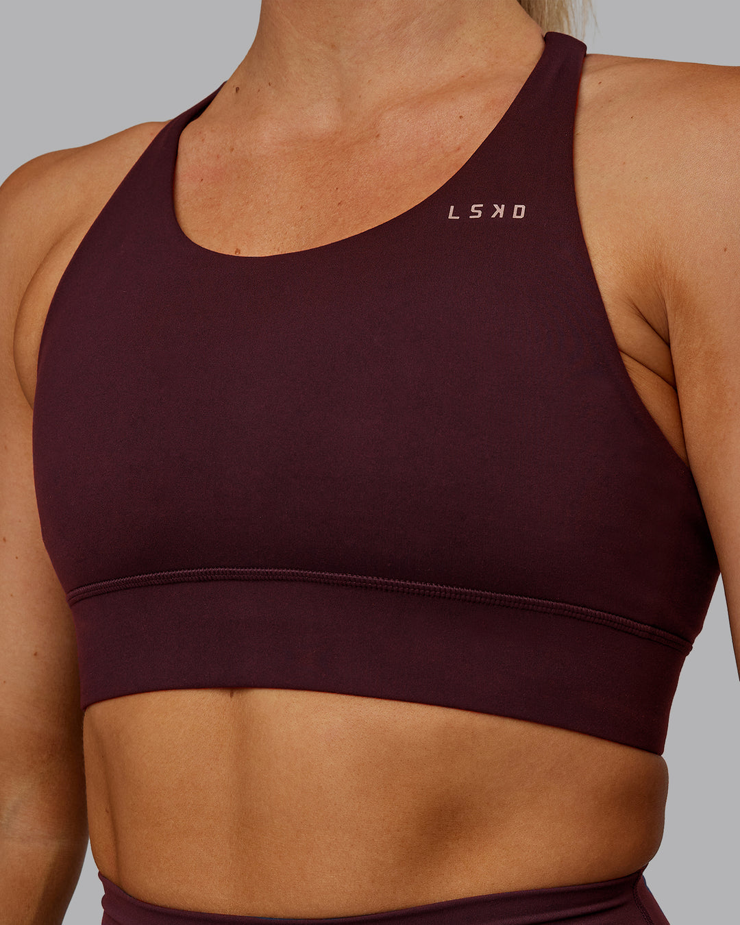 Woman wearing Accelerate Sports Bra - Cherry Lacquer | Model:Hannah | Size:S