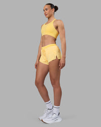 Woman wearing Accelerate Sports Bra - Lemon | Model:Sophie | Size:S | Thumbnail Index: 3