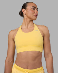 Woman wearing Accelerate Sports Bra - Lemon | Set:true | Angle:front | Model:Sophie | Size:S | Thumbnail Index: 4