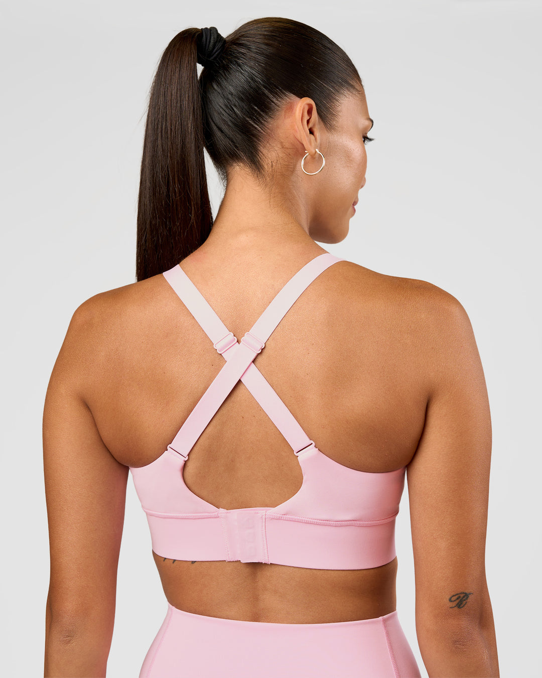 Woman wearing Accelerate Sports Bra - Marshmallow | Set:true | Angle:back | Model:Rhiley | Size:S