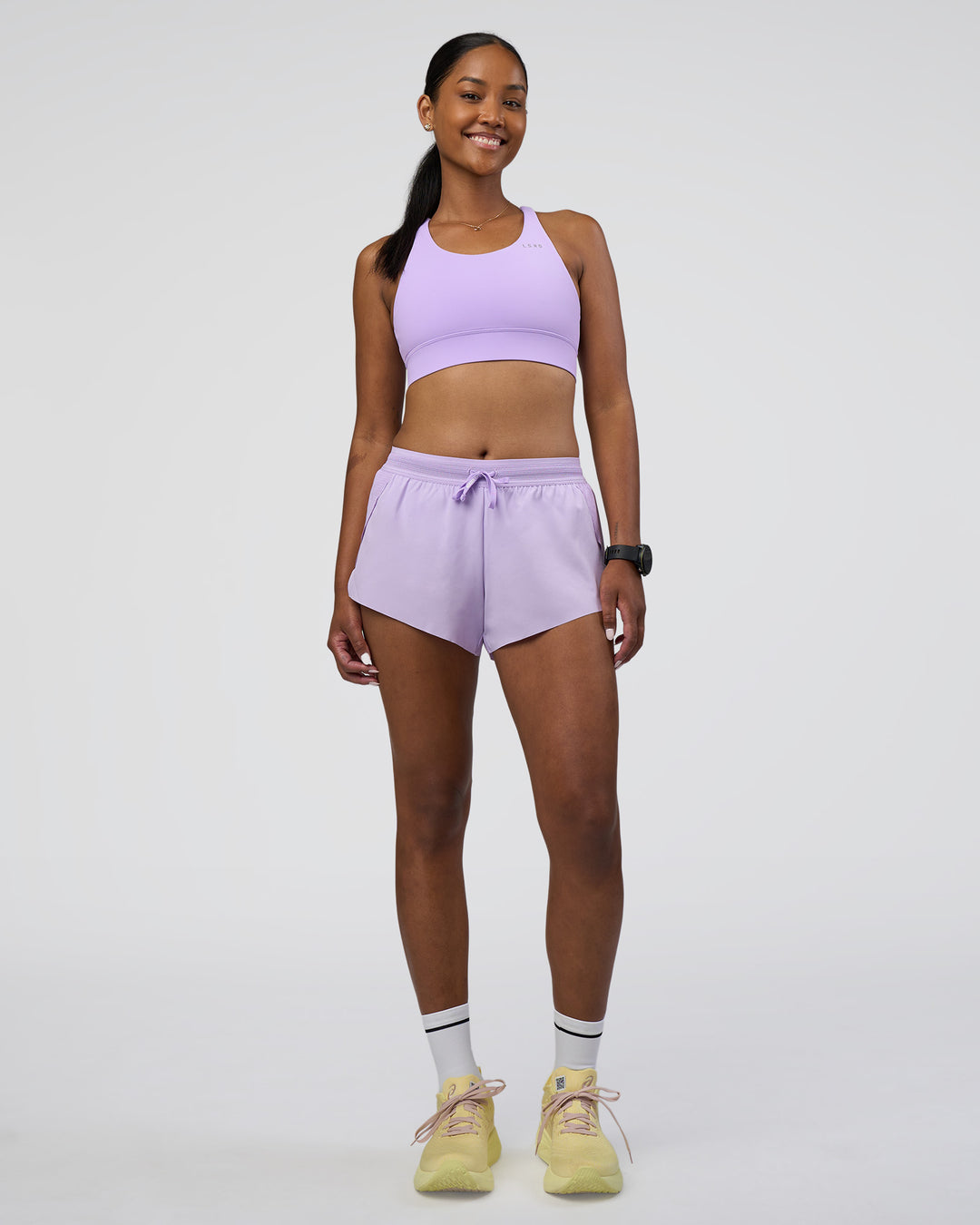 Woman wearing Accelerate Sports Bra - Pale Lilac | Model:Rica | Size:S