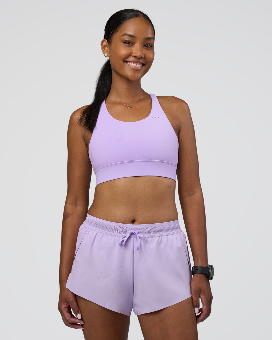 Woman wearing Accelerate Sports Bra - Pale Lilac | Model:Rica | Size:S