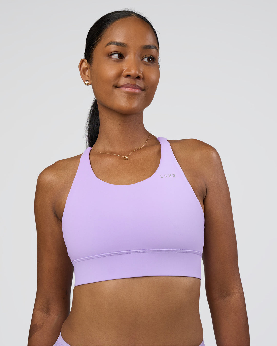 Woman wearing Accelerate Sports Bra - Pale Lilac | Model:Rica | Size:S