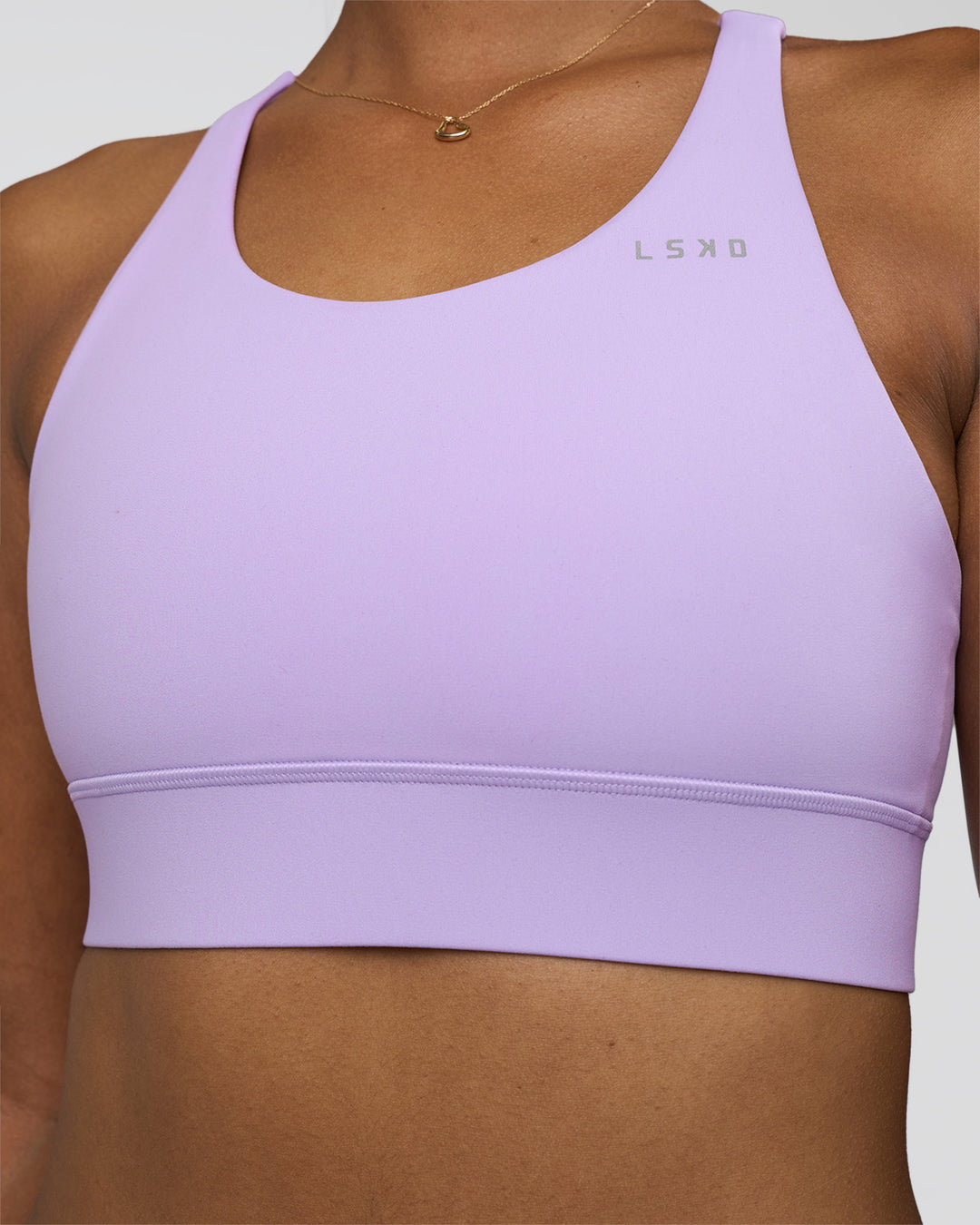 Woman wearing Accelerate Sports Bra - Pale Lilac | Model:Rica | Size:S
